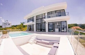A modern two-story house with a swimming pool, large windows, and a balcony. - Beautiful Ocean And Mountain View  (Las Terrenas)