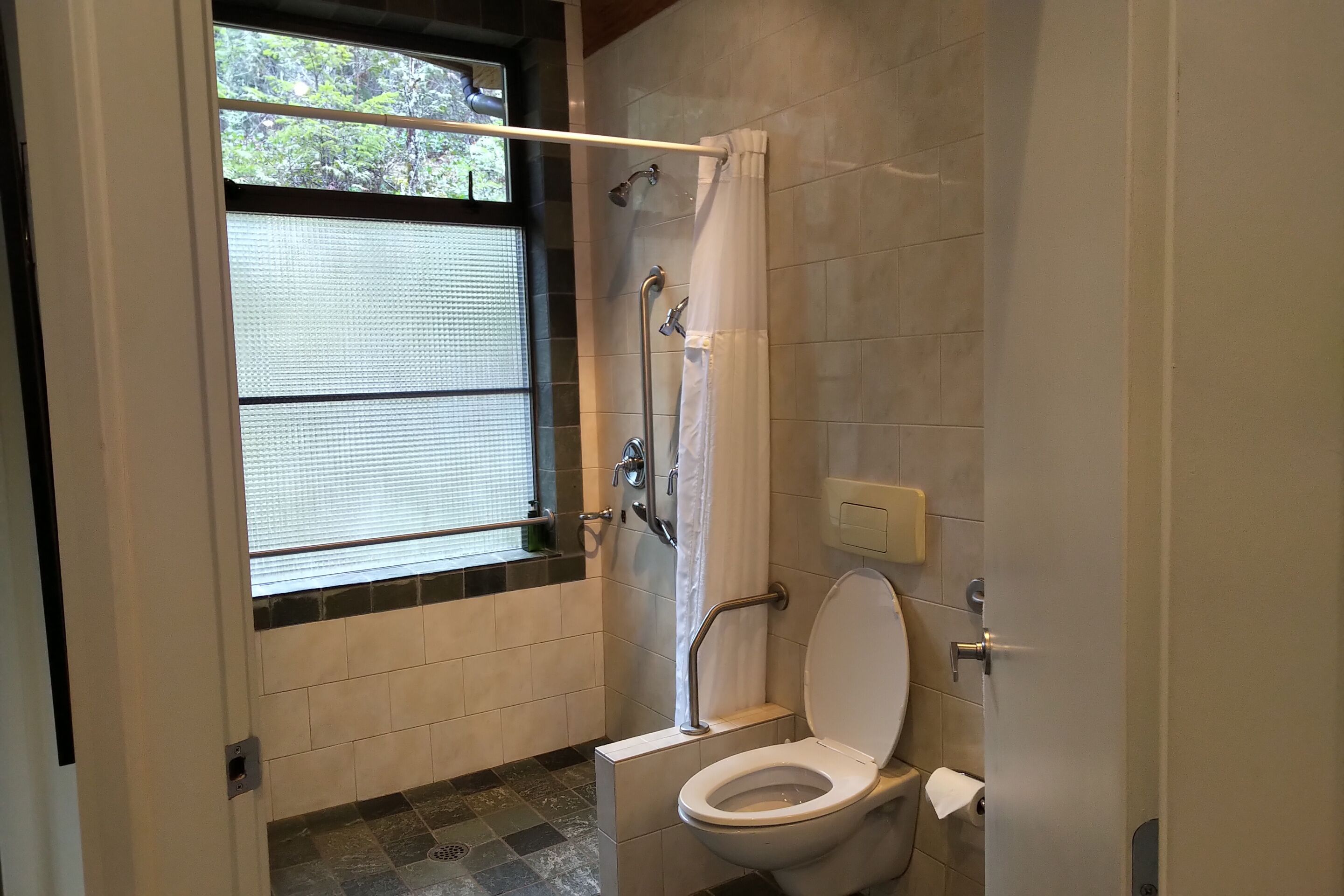 Bathtub, hair dryer, towels, soap