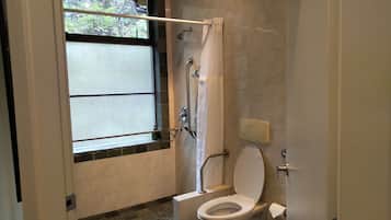 Bathtub, hair dryer, towels, soap