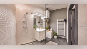 Shower, hair dryer, towels, soap