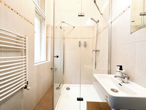 Shower, hair dryer, towels, soap
