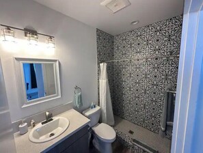 Shower, eco-friendly toiletries, hair dryer, towels