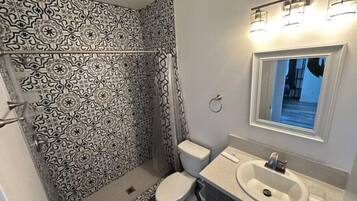 Shower, eco-friendly toiletries, hair dryer, towels