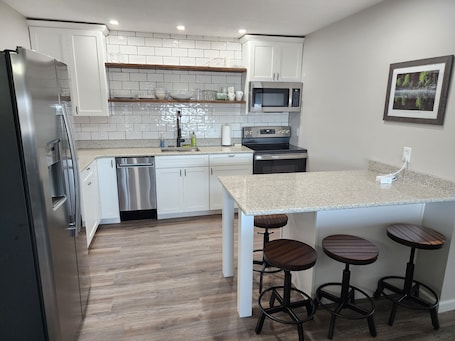 Fridge, microwave, oven, stovetop. Green Lake Condo in the heart of Spicer