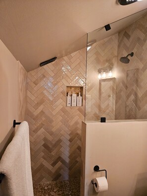 Shower, hair dryer, towels, soap