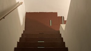 A staircase with alternating dark and light steps, leading upwards. - Two Story Country Setting 2 miles from down town. (South Haven Charter Township)