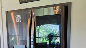 A stainless steel refrigerator with a water dispenser and a glass door. - Two Story Country Setting 2 miles from down town. (South Haven Charter Township)