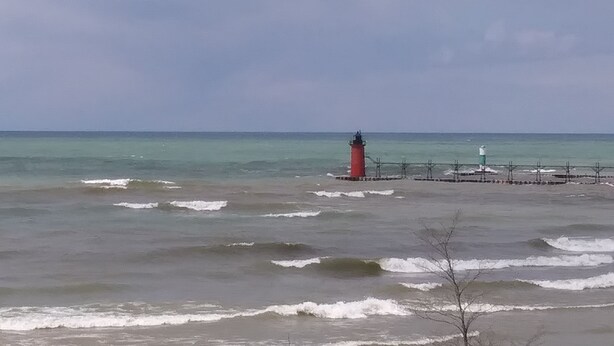 A lighthouse by the sea with a clear sky. - Two Story Country Setting 2 miles from down town. (South Haven Charter Township)