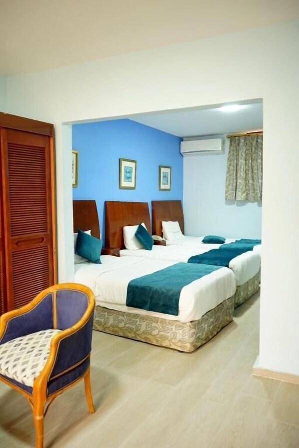 Premium Triple Room | Desk, laptop workspace, free WiFi, bed sheets