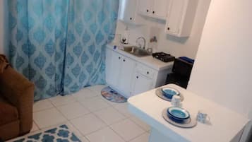 Fridge, microwave, electric kettle, cookware/dishes/utensils