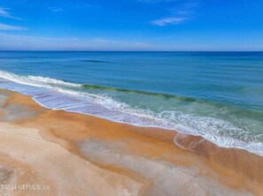 On the beach, sun loungers, beach towels