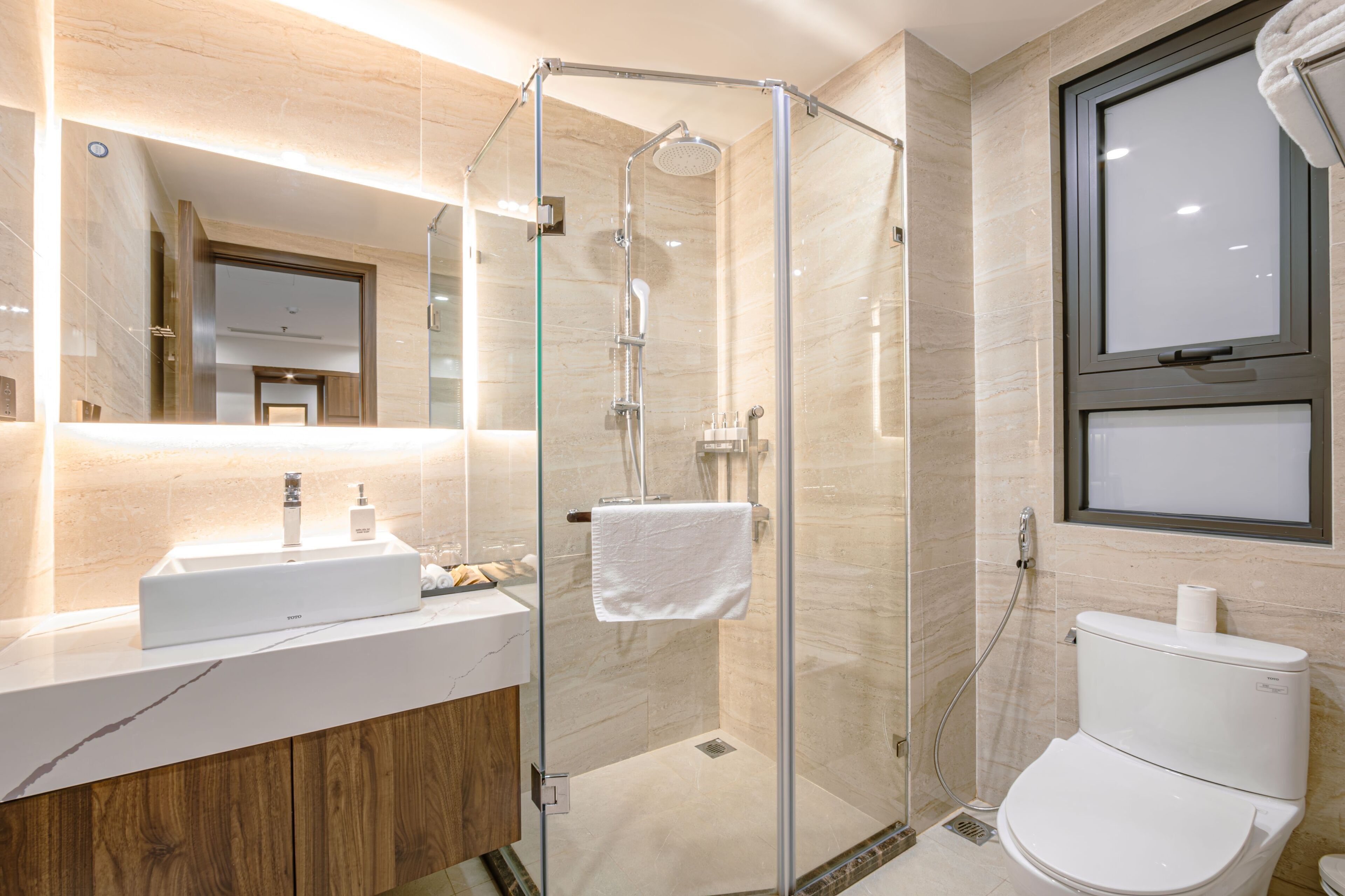 Designer toiletries, hair dryer, bathrobes, slippers