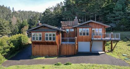The ocean meets the meadow at the forest's edge. Private beach. Soak under stars