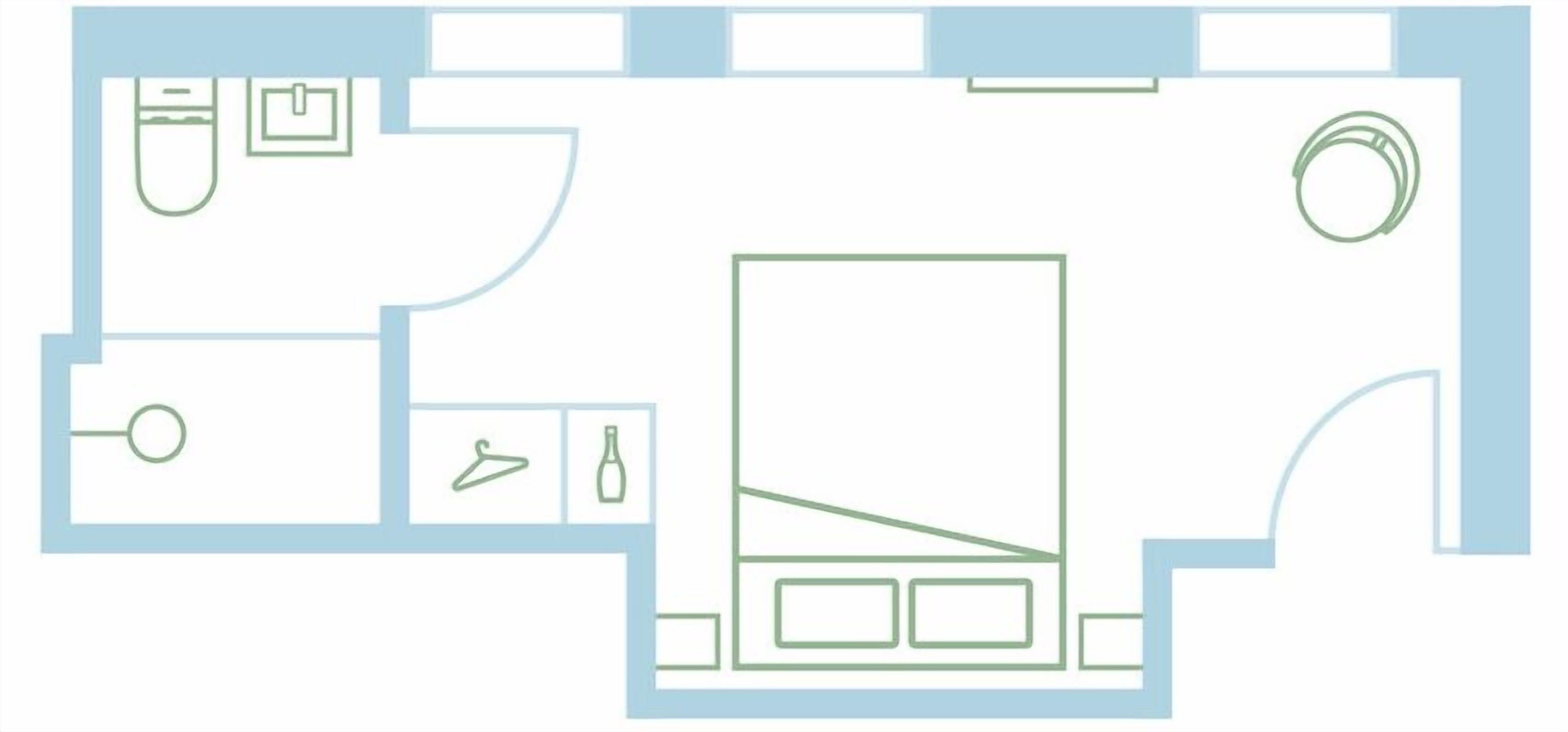 Un plan d’étage comprenant une cuisine, une salle de bain et un espace de vie.