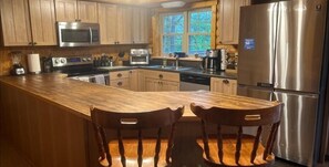 Design House | Private kitchen | Full-size fridge, microwave, stovetop, dishwasher
