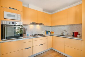 Coffee/tea maker, toaster, high chair, dining tables