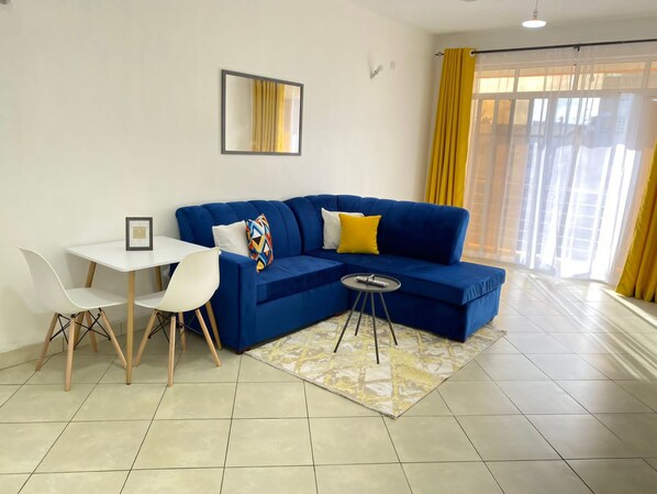 34-inch flat-screen TV with digital channels, TV - Favor Apartments Near Nyali Cinemax (Mombasa)