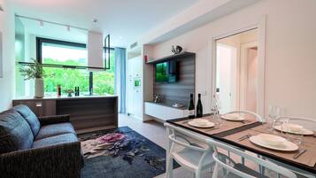 A modern kitchen with a dining area.