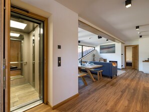 Exclusive Penthouse, 2 Bedrooms, Patio, Mountain View | Living area | 55-inch LED TV with satellite channels, TV, heated floors - Alpine Homes - Hopfgarten Zentrum (Hopfgarten im Brixental)