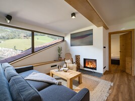 Exclusive Penthouse, 2 Bedrooms, Patio, Mountain View | Living area | 55-inch LED TV with satellite channels, TV, heated floors