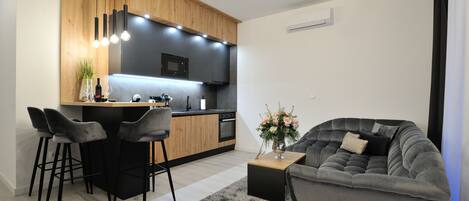 Exclusive Apartment, 2 Bedrooms, Kitchen | Living area | 56-inch Smart TV with cable channels, TV