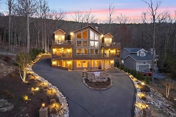 This exquisitely designed home embodies the essence of a "Luxurious Mountain Lodge." Situated within Massanutten Resort, it offers stunning views of Massanutten Peak during the winter.