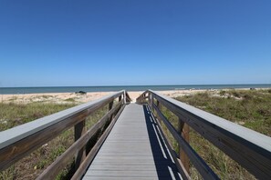 A wooden boardwalk leading to a beach with clear skies. - Sea Winds 16-Beautiful 2 Bedroom 2.5 Bath Townhome (St. Augustine)