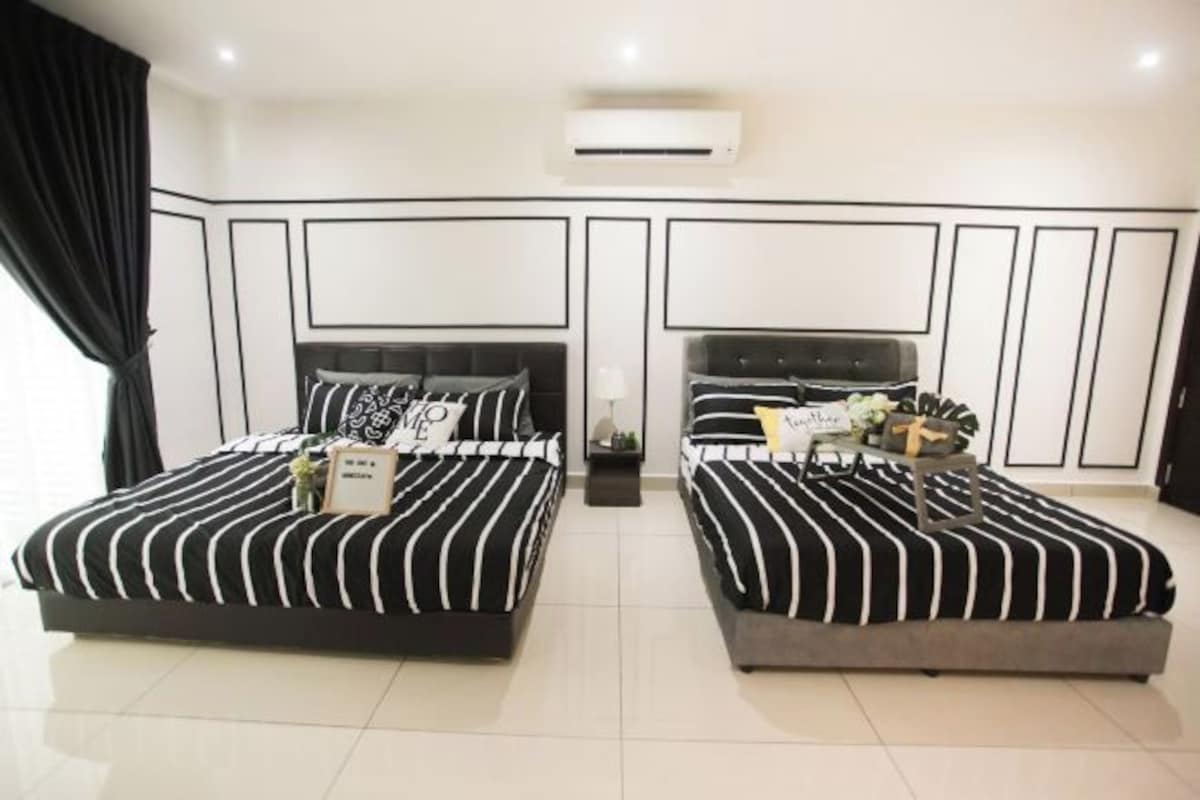 Quarto moderno com duas camas, ar condicionado central e design minimalista.