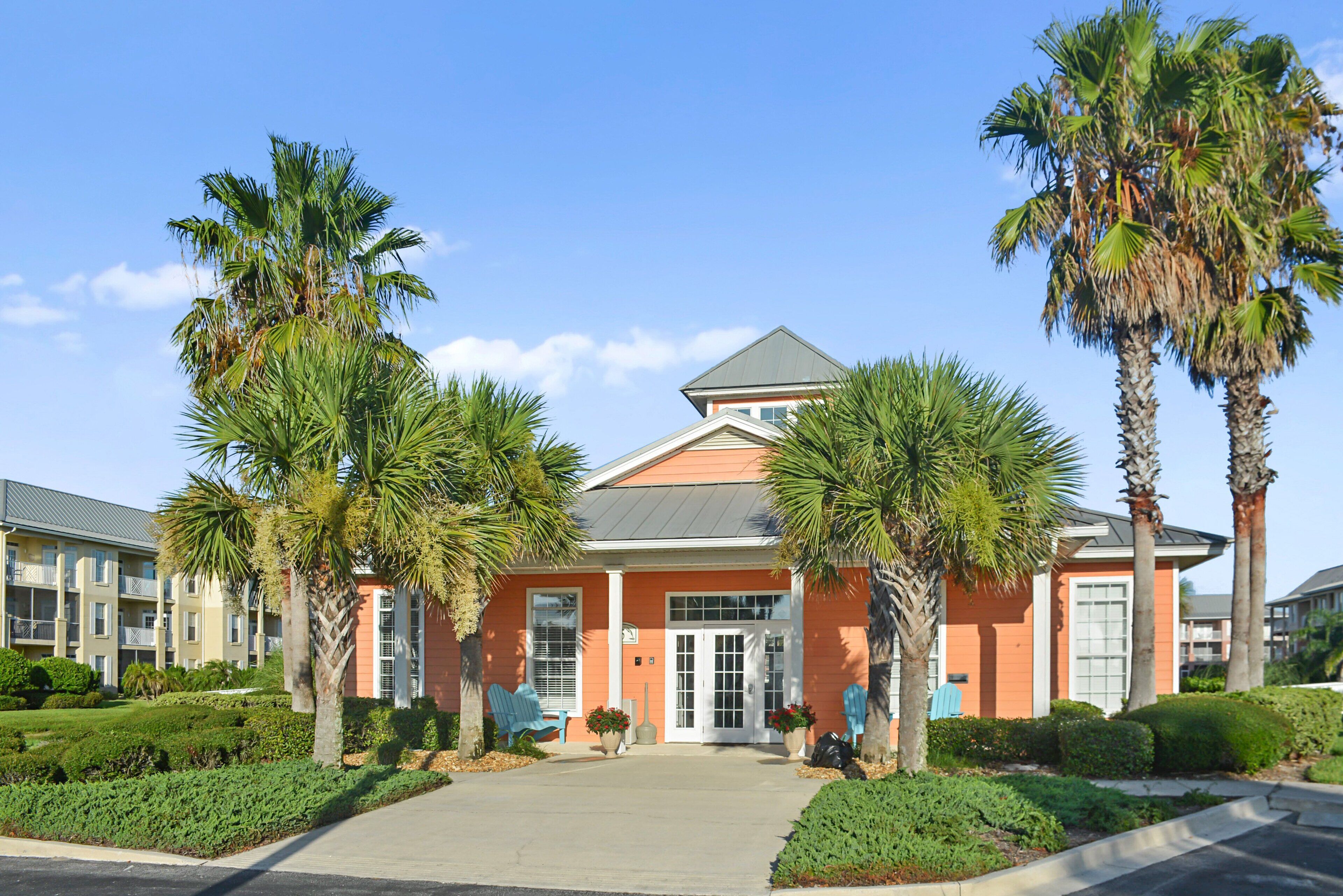 A building with a symmetrical facade, a central entrance, and a flat roof.