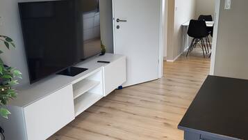 Deluxe Apartment | Living room | 30-cm Smart TV with cable channels, TV
