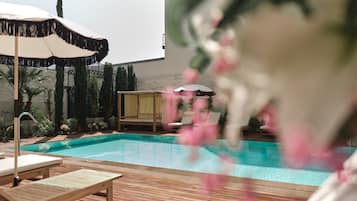 Indoor pool, outdoor pool, open 8:00 AM to 8:00 PM, pool umbrellas