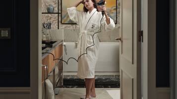 Shower, designer toiletries, hair dryer, bathrobes