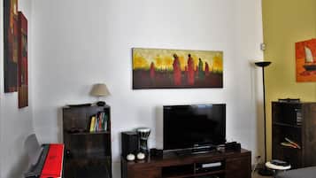 Basic Villa | Living area | 50-inch Smart TV with digital channels, TV, Netflix