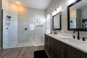 Combined shower/tub, hair dryer, towels, toilet paper