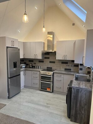 Fridge, microwave, oven, stovetop - The Grey Retreat (Shepperton)