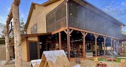 Lakefront, covered dock, hot tub, game/pool rm, 4wd trails, firepits, 22 people