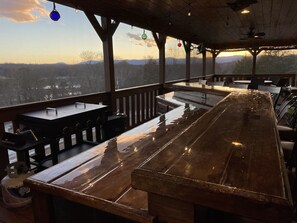 Bar with mountain and water view