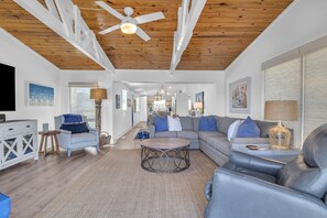 TV, books - Let The Fin Begin: Cozy Waterway Cottage with Breathtaking Views and Boat Dock (Oak Island)