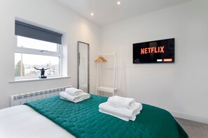 4 bedrooms, iron/ironing board, travel cot, WiFi