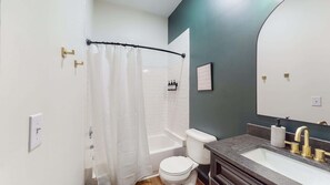 Bathtub, hair dryer, towels