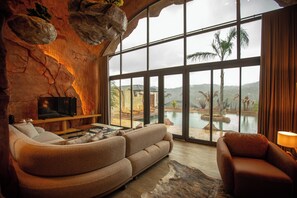 Signature Villa | Living area | 106-cm LED TV with satellite channels, heated floors - Arborea Hotel (Yomra)
