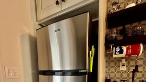 A stainless steel refrigerator with a freezer compartment, a built-in ice maker, and a water dispenser. - Historic Love, Modern Appeal C (Haines City)