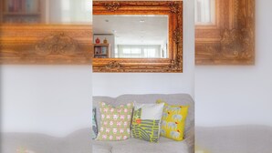 A room with a sofa and a mirror with ornate wooden frame. - Peaceful Hidden Gem, Heart of South East London (London)