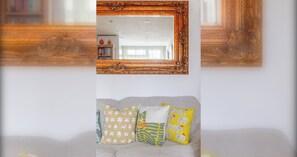 A room with a sofa and a mirror with ornate wooden frame. - Peaceful Hidden Gem, Heart of South East London (London)