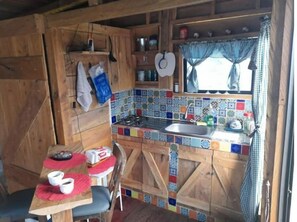 Fridge, coffee/tea maker, cookware/dishes/utensils, paper towels