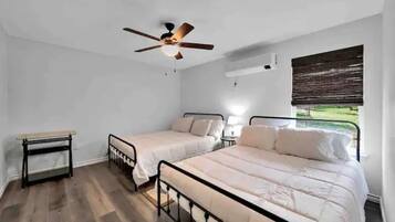 1 bedroom, desk, iron/ironing board, travel crib