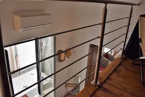 Enjoy a clean and functional space with a large window and comfortable seating area.