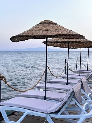 Private beach, free beach shuttle, sun loungers, beach umbrellas