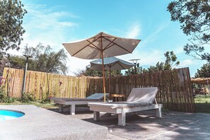 Outdoor pool, open 8:00 AM to 8:00 PM, pool umbrellas, pool loungers