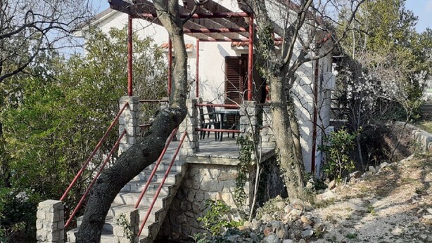 A stone staircase leading to a wooden pergola with a table and chairs underneath. - Apartments Rudi - Superior One bedroom Apartment with Terrace and Sea View (Klenovica)